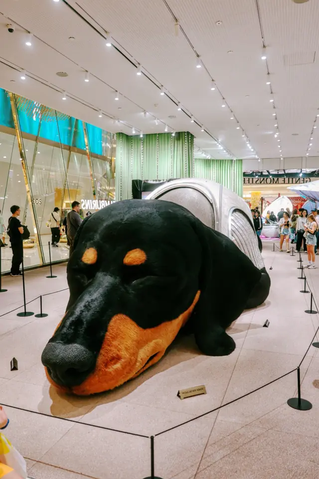 A giant sleeping dachshund sculpture